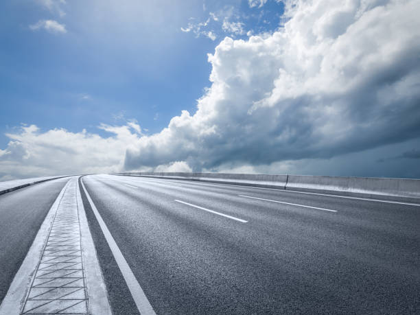 istock Asphalt road and sky cloud 1437824034