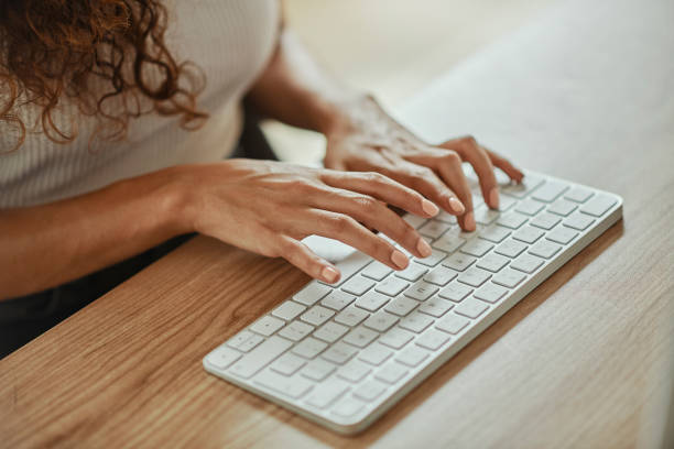 istock Keyboard, hands and business woman typing and doing work in office. Technology, journalism and closeup of female with wireless keypad for working on documents, research and writing email in workspace 1437824163