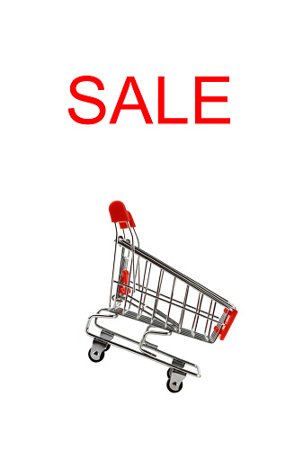 Sale text and shopping cart on a white background
