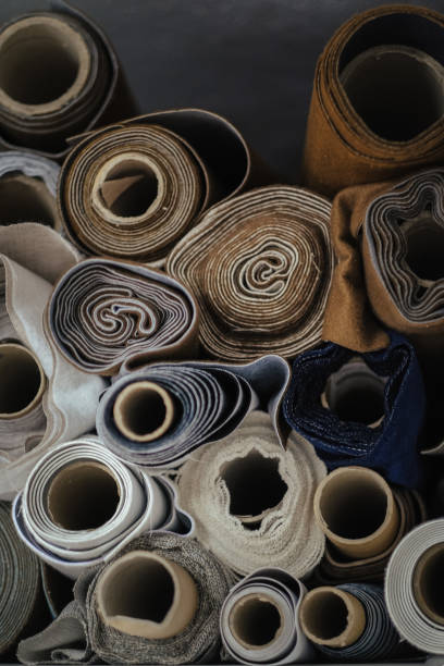 istock Vertical closeup shot of rolls of different fabrics 1437825757
