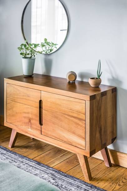 istock Cozy wooden drawer with plants and a mirror 1437826125