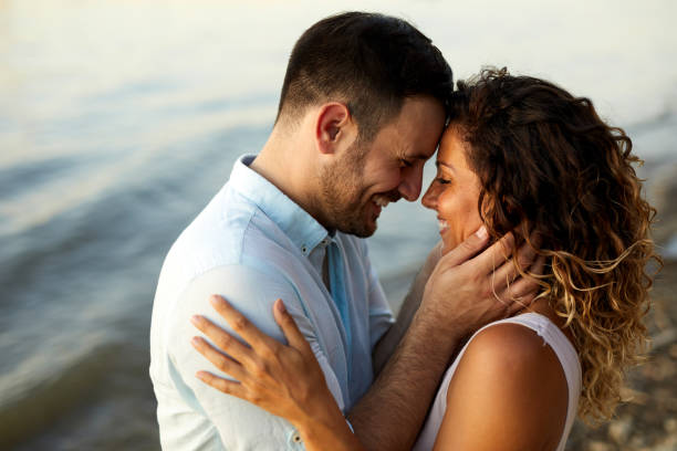 istock Couple in love by the river 1437826324
