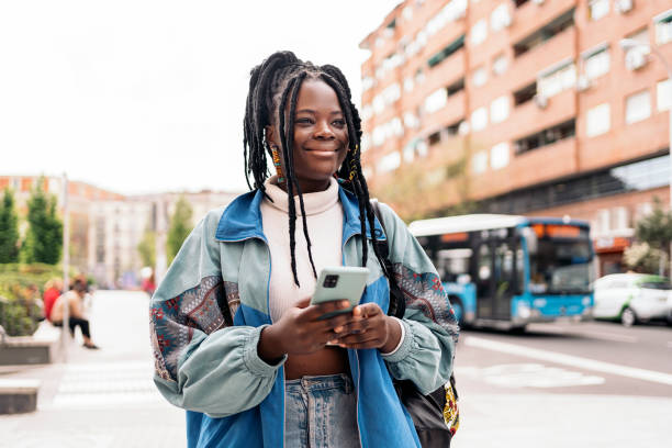 istock Pretty African Girl Using Phone 1437827260