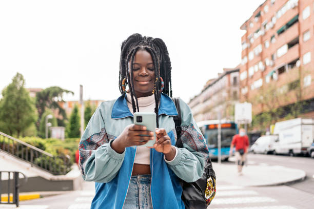 istock Pretty African Girl Using Phone 1437827304