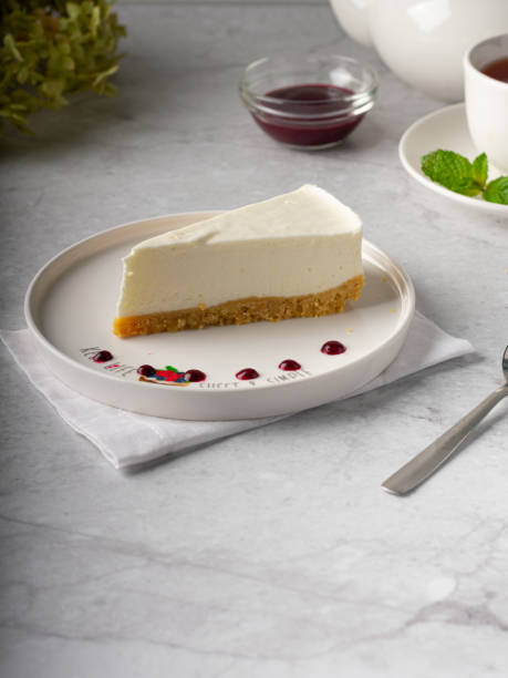 istock Classic Cheesecake dessert on white plate on marble background 1437827354