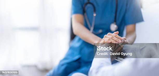 Cropped Shot Of A Female Nurse Hold Her Senior Patients Hand Giving Support Doctor Helping Old Patient With Alzheimers Disease Female Carer Holding Hands Of Senior Man Stock Photo - Download Image Now