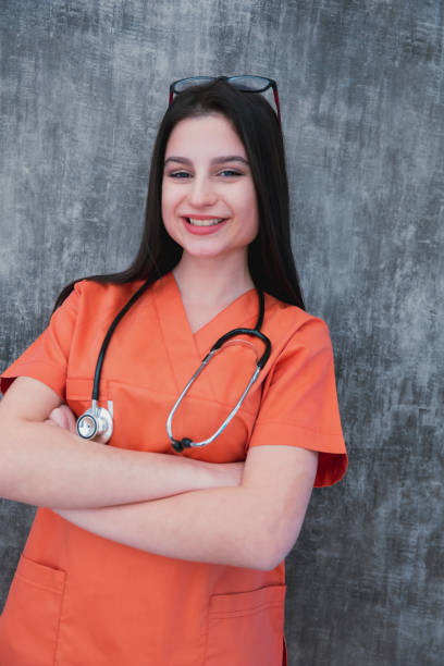 Young medical worker with arms folded