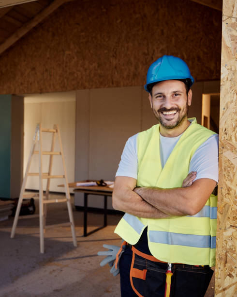 istock Happy construction worker with crossed arms during home renovation. 1437833442