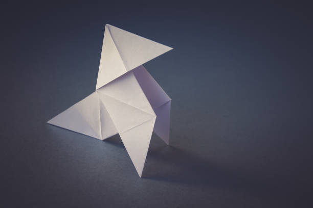 istock White paper hen origami isolated on a grey background 1437833891