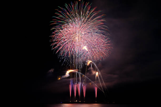 istock Fireworks launched from the sea embankment 1437834964