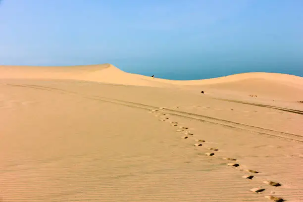 Photo of Footprints on the beautiful coastal sand dunes in the town of Mui Ne