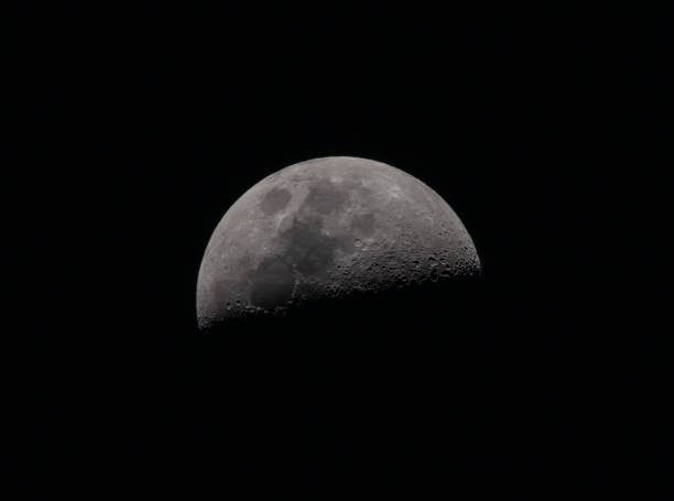 istock Closeup of full moon in black night sky 1437837821