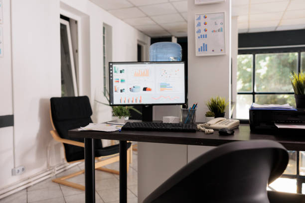 istock Empty office at the beginning of the day with growth statistics 1437839528