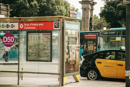 Barcelona, Spain. 20 June 2022: A bus stop and a taxi in Barcelona