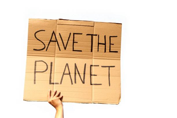 istock A Cardboard Signs saying Save the Planet held by two hands on a white background 1437840456