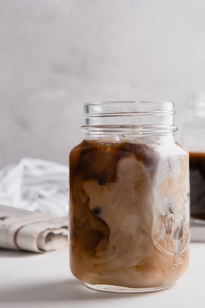 istock Vertical shot of making a coffee milk latte in a jar 1437840537