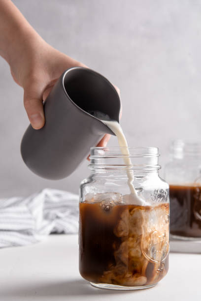 istock Vertical shot of making a coffee milk latte in a jar 1437840543