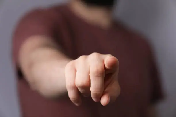 A man pointing to you with his finger