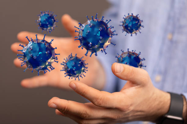 istock Hands and Covid-19 bacteria flying in the air 1437840970