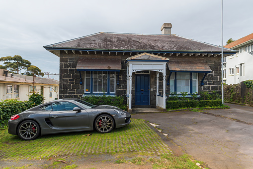 Auckland, New Zealand – September 14, 2019: Auckland / New Zealand - September 14 2019: View of small old stone house converted into commercial office in Parnell