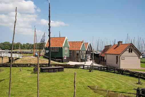 A traditional Dutch village with colorful, old wooden houses and canals