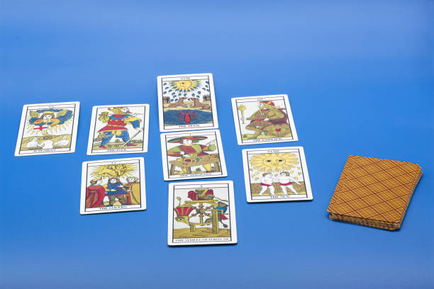 istock Tarot cards isolated on a blue background 1437841932