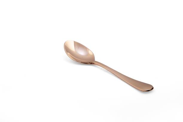 istock Bright shiny bronze spoon isolated on white background 1437841998