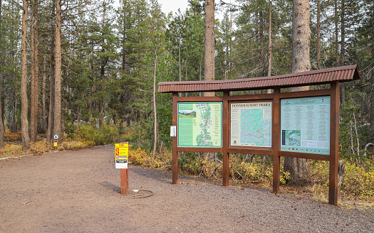 Donner Summit, California, United States – October 08, 2020: A large interpretive sign marks the trailhead at the Pacific Crest Trail Highway 80 Trailhead Parking Lot.