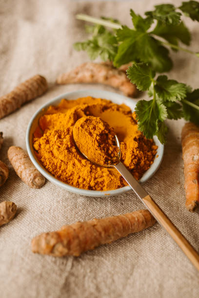 istock Turmeric powder and roots with coriander. Indian spices. 1437843479