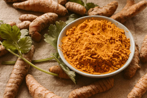 istock Turmeric powder and roots with coriander. Indian spices. 1437843483
