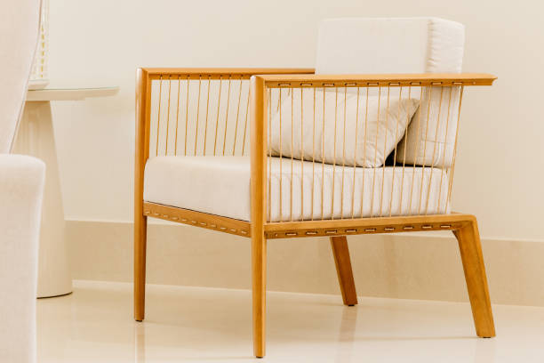 istock Modern chair with white cushions in a white room 1437843776