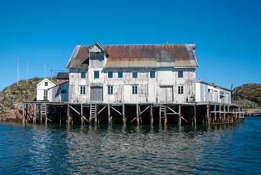 Old weathered wooden boathouses, Havel River, Brandenburg State