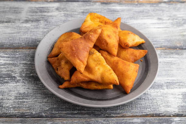 istock nachos on gray plate on a gray wooden background. Side view. 1437844123
