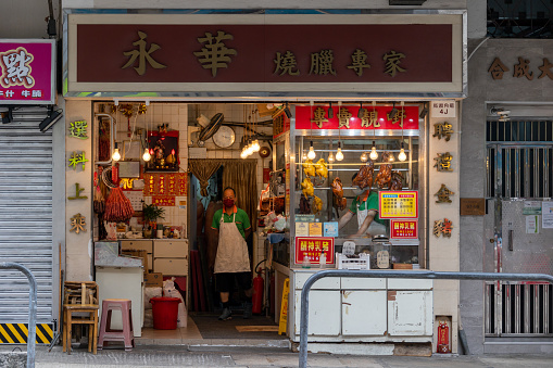 Hong Kong - October 31, 2022 : Chefs at Wing Wah Roasted Meat Restaurant in To Kwa Wan, Kowloon, Hong Kong.