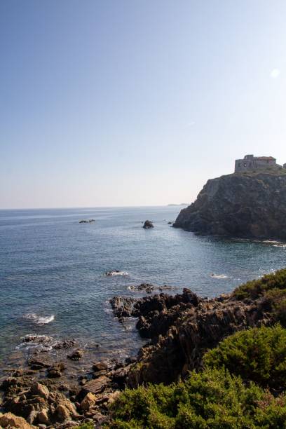 istock Vertical high angle of a rocky coast with castle ruins 1437845537
