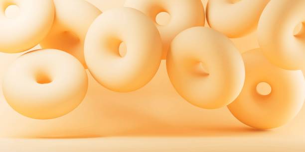 istock 3D rendering of abstract flying donuts against beige surface 1437845638