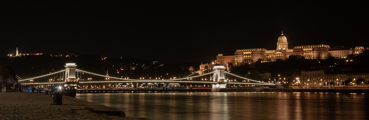 A panoramic view of the Chian Bridge in Budapest with lights at night