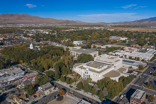 Carson City, Nevada, United States – October 14, 2020: An aerial view over Nevada's Capitol Mall with the State Legislature, State Supreme Court and State Capitol buildings.