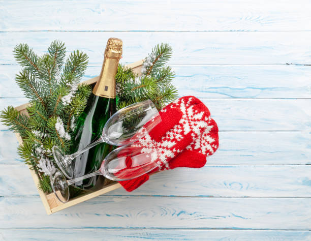 istock Christmas gift box with champagne bottle 1437847601