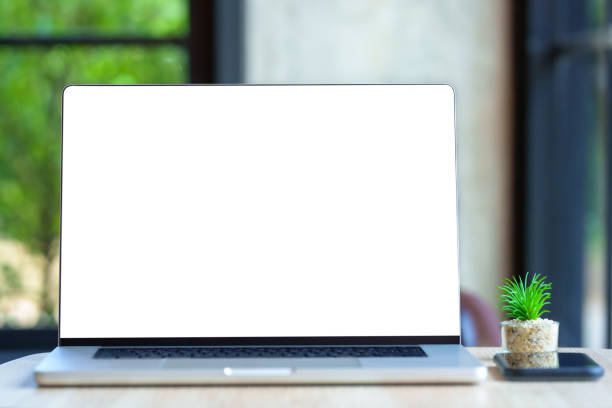 istock laptop computer on Wood office desk table in office 1437848903