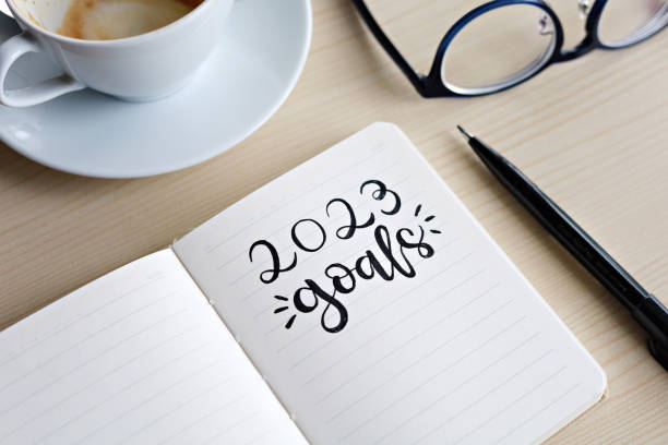 istock 2023 goals, written in notebook on wooden desk. 1437849035