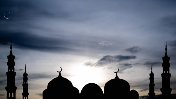 istock Mosques Dome,Crescent Moon on Sunset Twilight Sky Background 1437849057