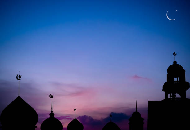 istock Mosques Dome,Crescent Moon on Sunset Twilight Sky Background 1437849078