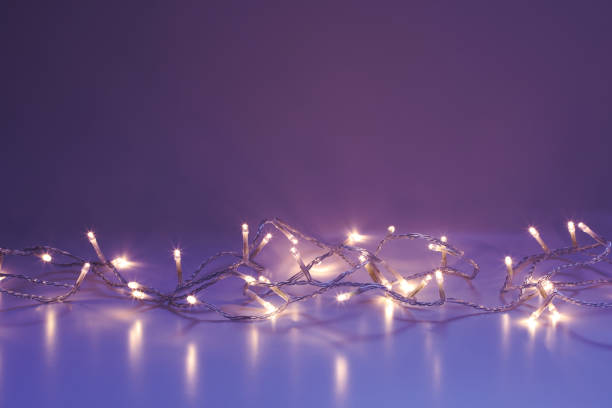 istock Warm white LED lights on Purple Blue background 1437850090