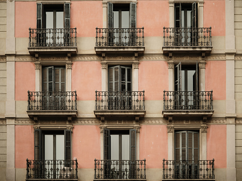 Beautiful apartment building facade with balconies in Barcelona