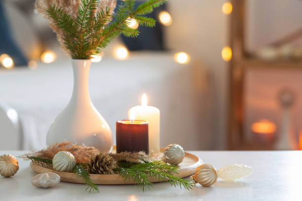istock burning candles with christmas decor in white cozy interior 1437853109