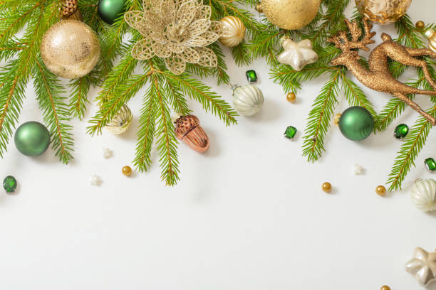 istock golden and green  christmas decorations  on white  background 1437853174