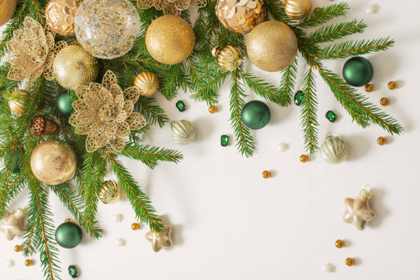 istock golden and green  christmas decorations  on white  background 1437853175