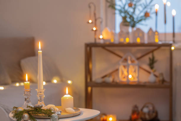 istock beautiful white room with christmas decor with burning candles 1437853190