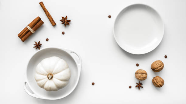 istock A pumpkin and spices on a white table 1437853205
